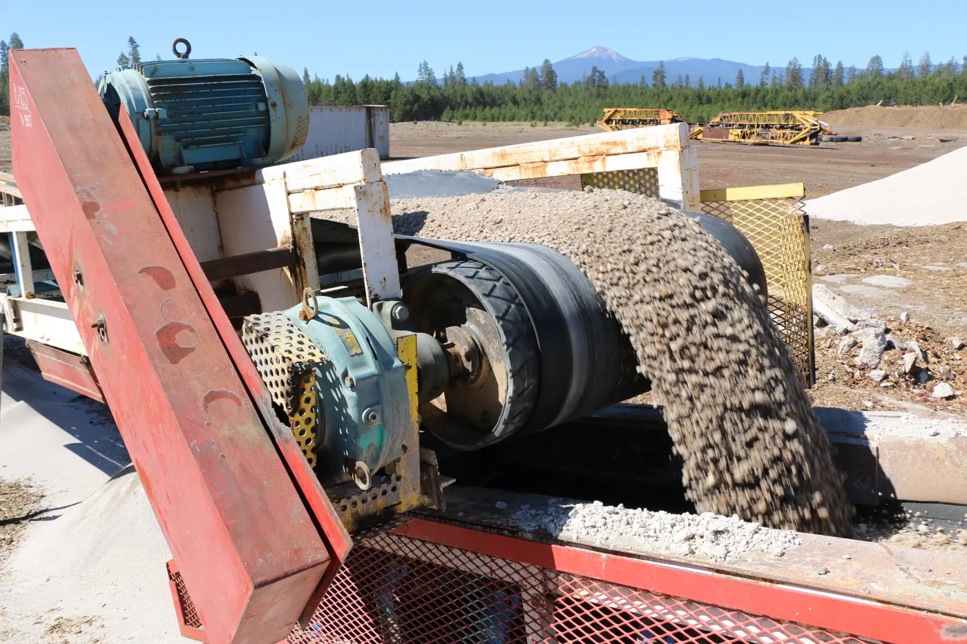 Pumice discharging from a conveyor belt at the Beaver Pumice processing plant
