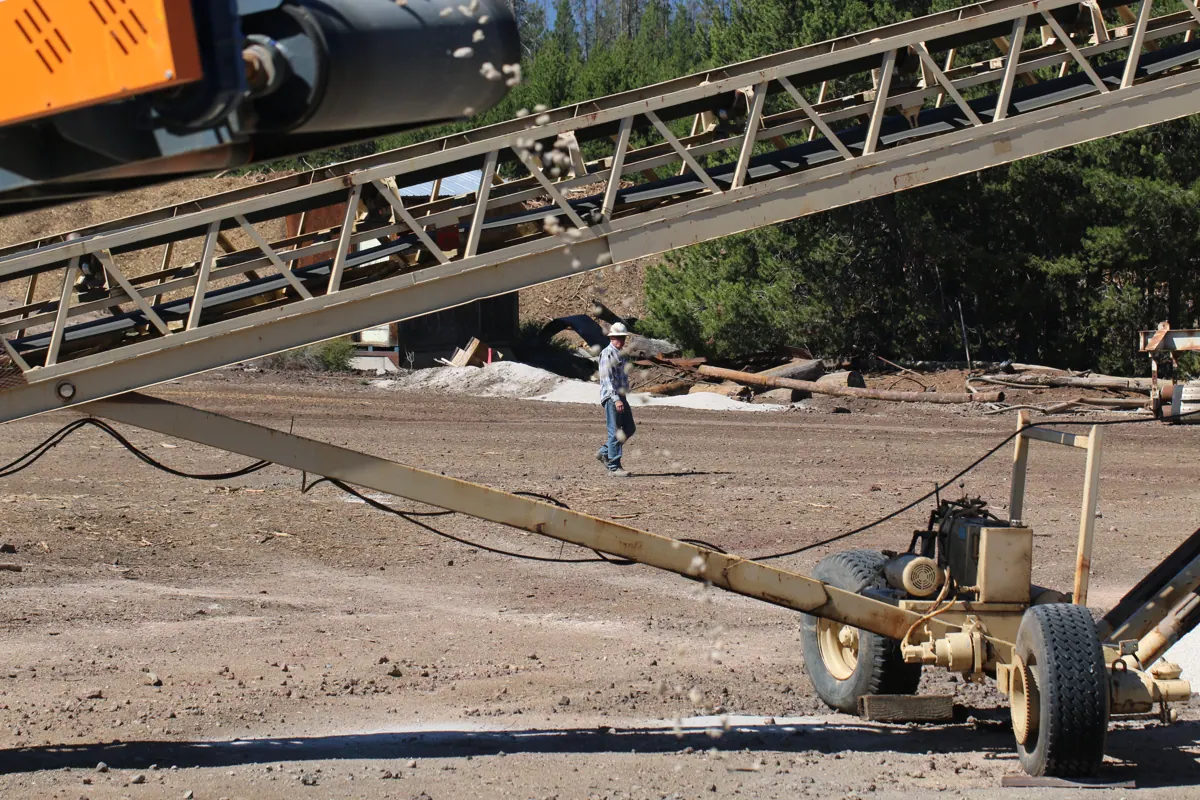 Conveyors and crew in the yard at the Beaver Pumice plant near Chemult, Oregon
